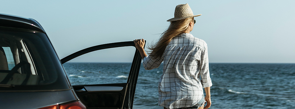 a person standing in front of a body of water