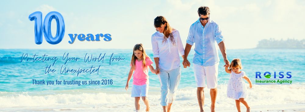 a group of people standing on a beach